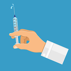 Image showing Doctor holding syringe in hand