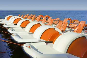 Image showing Colorful catamarans on leash