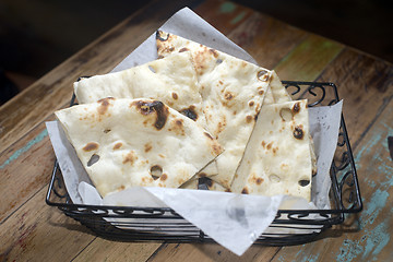 Image showing  naan bread  basket fresh baked