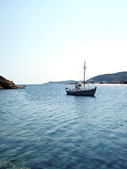 Image showing old wood sailboat in Mediterranean Sea Faros harbor on Greek Isl