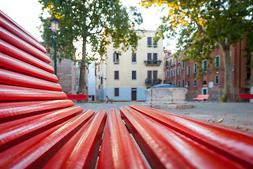 Image showing Venice from a red bench