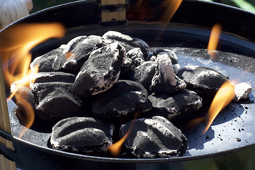 Image showing charcoal briquettes with flames