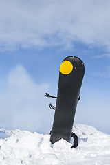 Image showing Snowboard in Snow