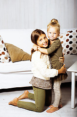 Image showing little cute brunette girl at home interior happy smiling close up, lifestyle real people concept