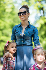 Image showing mother with her daughters in the park