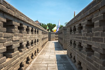 Image showing Stone path outdoors with large walls