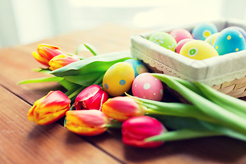 Image showing close up of colored easter eggs and flowers