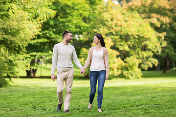 Image showing happy couple walking in summer park