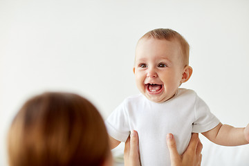 Image showing happy little baby with mother at home