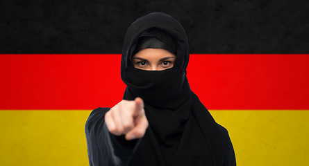 Image showing muslim woman in hijab pointing finger to you