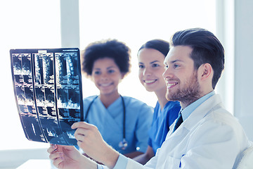 Image showing group of happy doctors discussing x-ray image