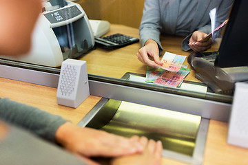 Image showing clerk counting cash money at bank office