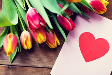 Image showing close up of flowers and greeting card with heart