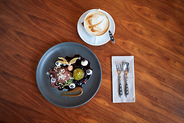 Image showing chocolate ice cream dessert on plate at restaurant