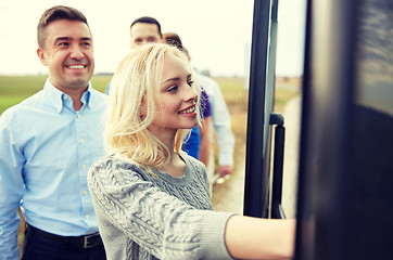 Image showing group of happy passengers boarding travel bus