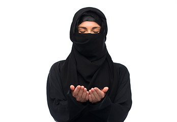 Image showing praying muslim woman in hijab over white