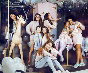 Image showing Lifestyle and people concept: young pretty diversity nations woman with different age children celebrating on birth day party together happy smiling, making selfie. African-american, asian and caucasi