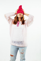 Image showing young pretty teenage hipster girl posing emotional happy smiling on white background, lifestyle people concept 