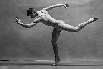 Image showing The male ballet dancer posing over gray background