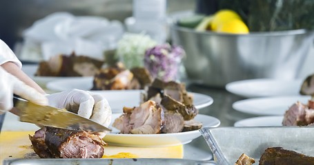 Image showing Preparing meat on the table