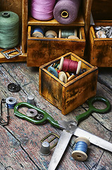 Image showing cupboard with threads and buttons