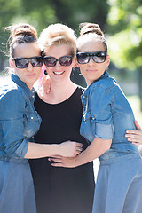 Image showing portrait of three young beautiful woman with sunglasses