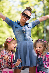 Image showing mother with her daughters in the park