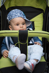 Image showing baby boy sitting in the pram