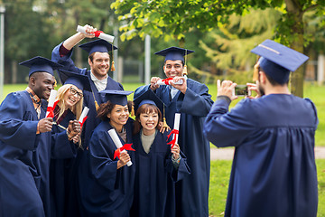 Image showing students or bachelors photographing by smartphone