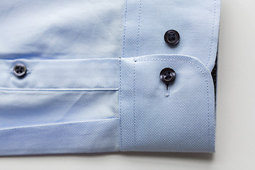 Image showing close up of blue shirt sleeve
