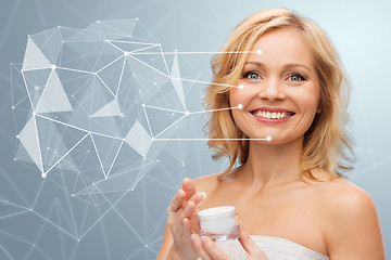 Image showing woman with moisturizer and low poly projection