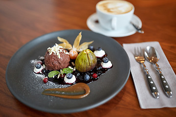 Image showing chocolate ice cream dessert on plate at restaurant