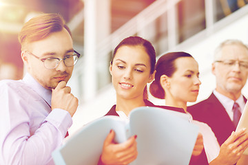 Image showing business team with folders meeting at office