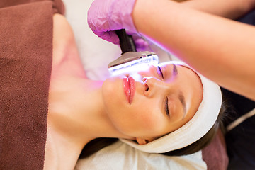 Image showing young woman having face microdermabrasion at spa