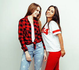 Image showing best friends teenage girls together having fun, posing emotional on white background, besties happy smiling, lifestyle people concept, blond and brunette multi nations 