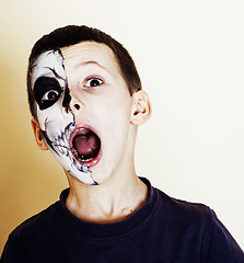 Image showing little cute boy with facepaint like skeleton to celebrate hallow
