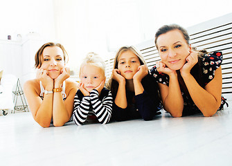 Image showing Mature sisters twins at home with little daughter, happy family 