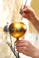 Image showing Decorating baubles, handmade Painting of Christmas decorations