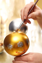 Image showing Preparation for the Christmas holidays, decorating glass ornaments