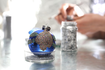 Image showing Painting Christmas balls. Manufacturing and crafts