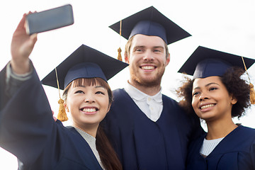 Image showing students or bachelors taking selfie by smartphone