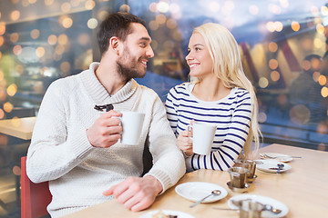 Image showing happy couple meeting and drinking tea