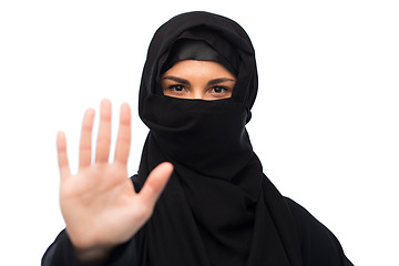 Image showing muslim woman in hijab showing stop sign