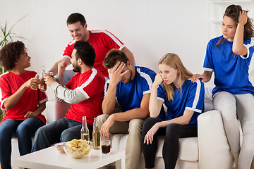 Image showing friends or football fans watching soccer at home