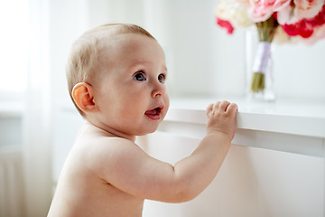 Image showing happy little baby boy or girl at home