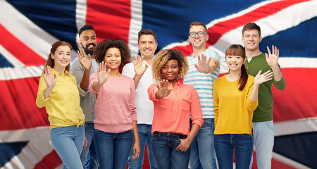 Image showing international group of happy people waving hand