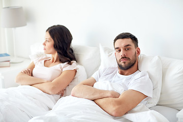 Image showing unhappy couple having conflict in bed at home