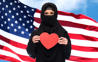 Image showing muslim woman in hijab holding red heart