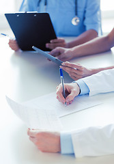 Image showing close up of happy doctors at seminar or hospital