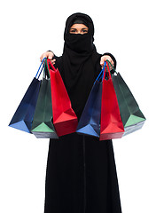 Image showing muslim woman in hijab with shopping bags